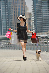 Image showing beautiful woman goes in shopping