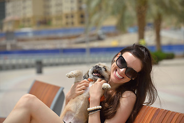 Image showing happy young woman with puppy have fun