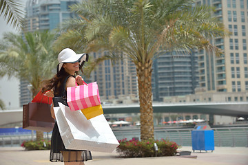 Image showing beautiful woman goes in shopping