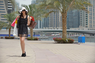 Image showing beautiful woman goes in shopping