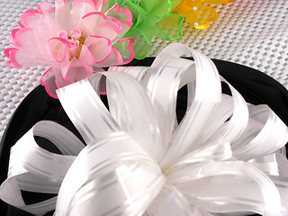 Image showing Floral pattern gift box tied with white ribbon