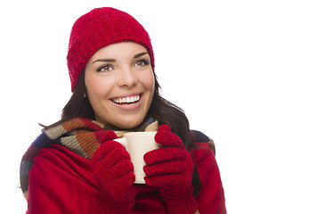 Image showing Mixed Race Woman Wearing Mittens Holds Mug Looks to Side