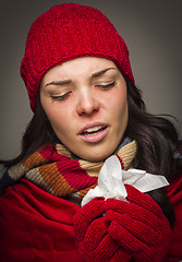 Image showing Sick Mixed Race Woman Blowing Her Sore Nose With Tissue