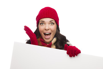Image showing Surprised Girl Wearing Winter Hat and Gloves Holds Blank Sign 