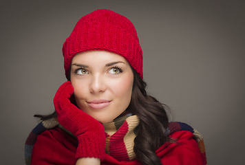Image showing Smiling Mixed Race Woman Wearing Mittens Looks to Side
