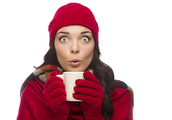 Image showing Wide Eyed Mixed Race Woman Wearing Winter Gloves Holds Mug 