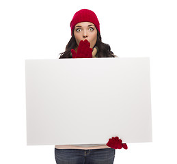 Image showing Stunned Girl Wearing Winter Hat and Gloves Holds Blank Sign 