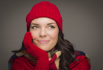 Image showing Mixed Race Woman Wearing Mittens Looks to Side