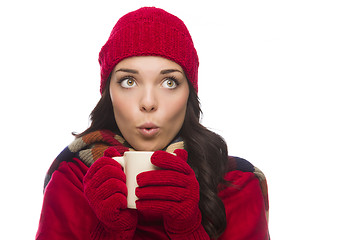 Image showing Mixed Race Woman Wearing Mittens Holds Mug Looks to Side