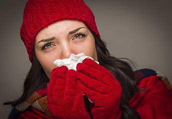 Image showing Sick Mixed Race Woman Blowing Her Sore Nose With Tissue