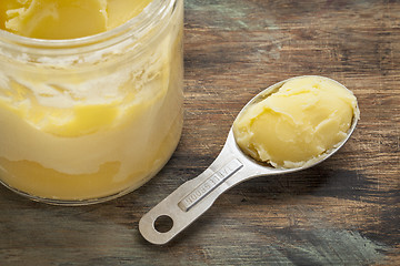 Image showing ghee in jar and spoon