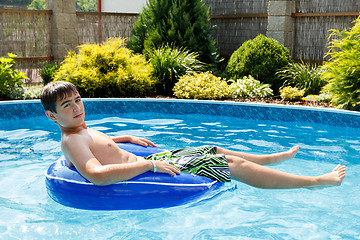 Image showing boy in the home swimming pool