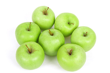 Image showing seven green apples isolated on a white background 