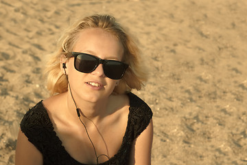 Image showing Young girl on the sandy beach