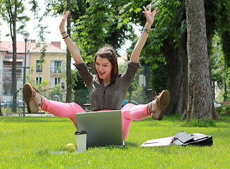 Image showing Happy Woman with Computer in an Urban Park