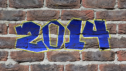 Image showing Old dark red brick wall texture  with graffity