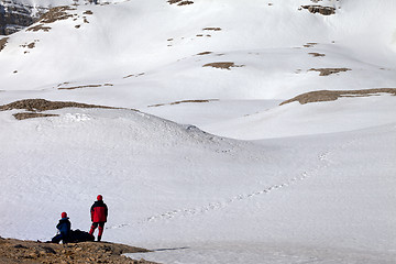 Image showing Two hikers on halt in snowy mountain