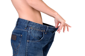 Image showing slim girl in big jeans