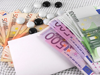 Image showing 500 euros currency, white empty paper and stones