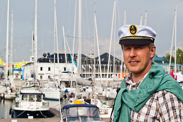 Image showing Portrait of a man in a sailor's Cap on the deck of a sailboat
