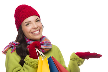 Image showing Mixed Race Woman Holding Shopping Bags Gesturing to Side