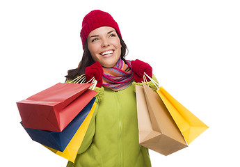 Image showing Mixed Race Woman Wearing Hat and Gloves Holding Shopping Bags