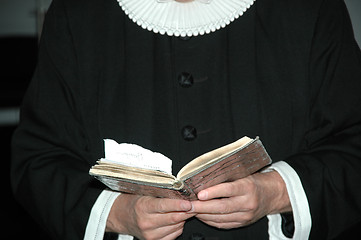 Image showing Priest and bible