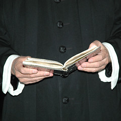 Image showing Priest and bible