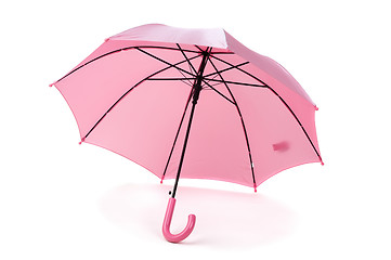 Image showing pink umbrella over white