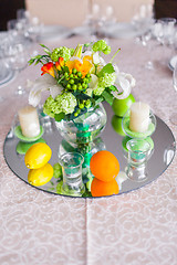 Image showing tables decorated with flowers and fruit