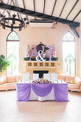 Image showing Bride and groom's table decorated with flowers