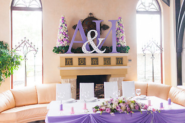 Image showing Bride and groom's table decorated with flowers