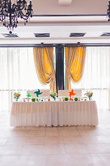 Image showing tables decorated with flowers and fruit