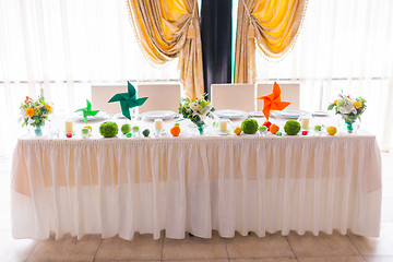 Image showing tables decorated with flowers and fruit