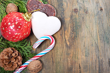 Image showing Ginger biscuits, Christmas balls and candy.