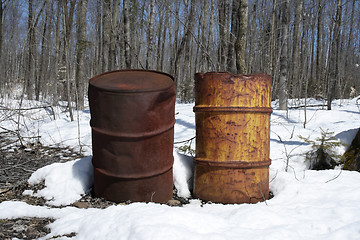 Image showing Rusty barrels in the forest