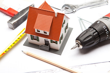 Image showing Scale model of house with tools