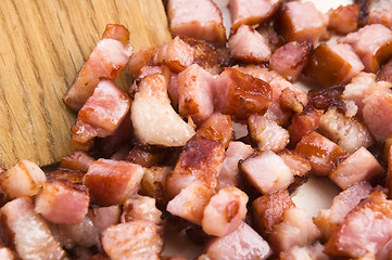 Image showing Macro photo of bacon being fried in a pan