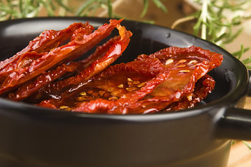 Image showing Sun dried tomatoes with olive oil