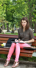 Image showing Woman Wiritng Outside in a Park