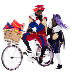 Image showing Zwarte Piet on a bike with presents