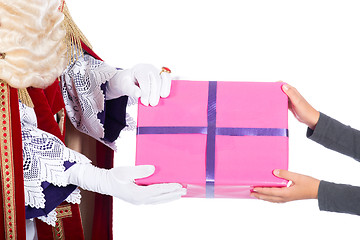 Image showing Sinterklaas is giving a present