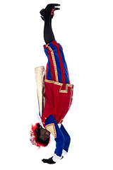 Image showing Zwarte Piet is doing a handstand