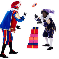 Image showing Zwarte Piet is throwing with the presents