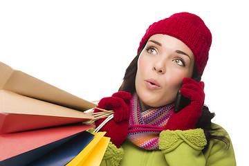 Image showing Mixed Race Woman Holding Shopping Bags On Cell Phone Looking