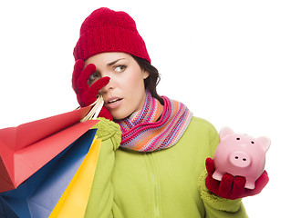 Image showing Concerned Expressive Mixed Race Woman Holding Shopping Bags and 