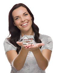 Image showing Pretty Mixed Race Woman Holding Small House Isolated on White