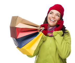 Image showing Mixed Race Woman Holding Shopping Bags On Cell Phone Looking Up