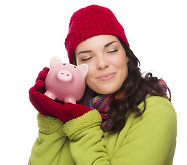 Image showing Pleased Mixed Race Woman Hugging Piggybank Isolated on White 