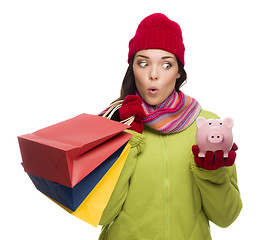 Image showing Concerned Mixed Race Woman Holding Shopping Bags and Piggybank